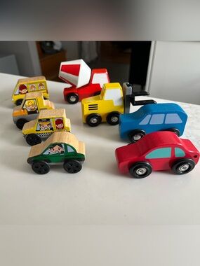 8 wooden cars and trucks.  Four are kidKraft.